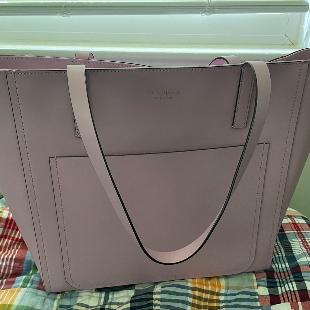 Kate spade tote! Great for work and travel. Pinkish purple